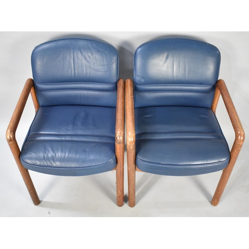 497 - A Set of Four Gordon Russell Teak Framed and Leather Upholstered Armchairs