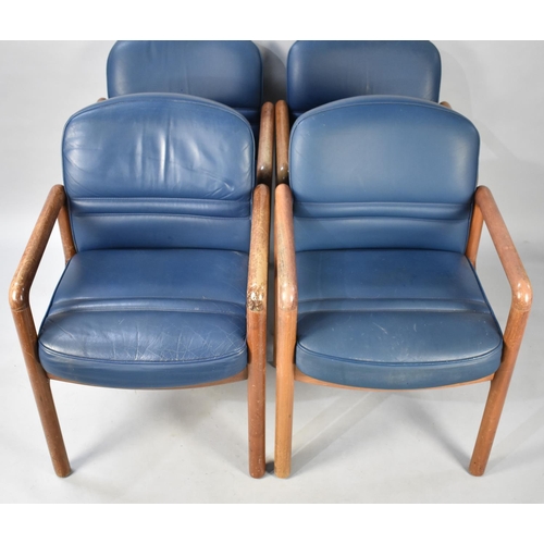 499 - A Set of Four Gordon Russell Teak Framed and Leather Upholstered Armchairs