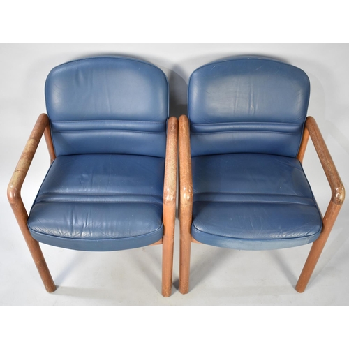 499 - A Set of Four Gordon Russell Teak Framed and Leather Upholstered Armchairs