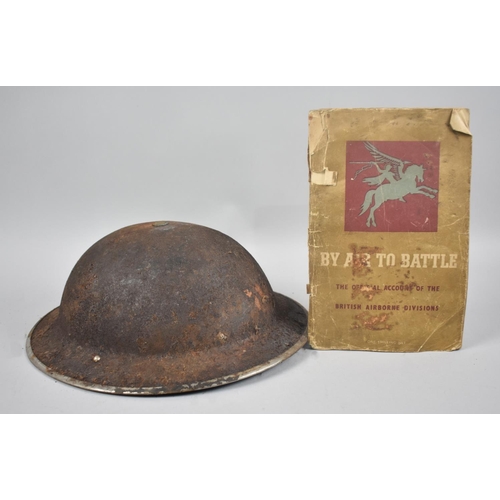 59 - A WWII Helmet together with Booklet 