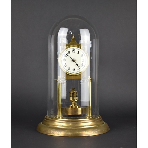 64 - A Mid 20th Century Brass Pillar Clock under Glass Dome, Overall Height 31cms