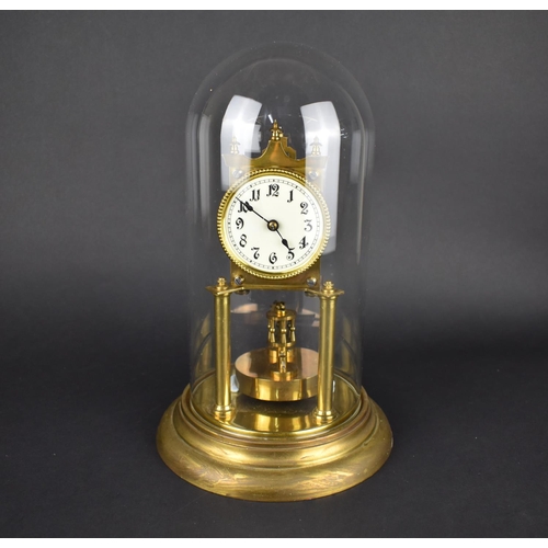 64 - A Mid 20th Century Brass Pillar Clock under Glass Dome, Overall Height 31cms