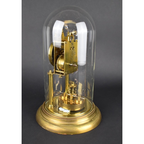 64 - A Mid 20th Century Brass Pillar Clock under Glass Dome, Overall Height 31cms