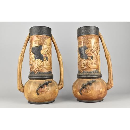 67 - A Pair of Tall Bretby Two Handled Vases decorated in Relief with Chinoiserie Figures and Lizards, 36... 