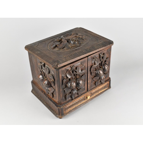 7 - A Late 19th Century Black Forest Carved Cigar Cabinet with Lift Up Lid, Hinged Side Quadrants and Ba... 