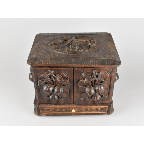 7 - A Late 19th Century Black Forest Carved Cigar Cabinet with Lift Up Lid, Hinged Side Quadrants and Ba... 