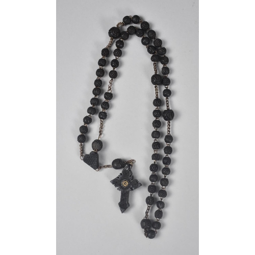 89 - A Whitby Jet Rosary with Crucifix Pendant having Integral Stanhope 'Sacre Coeur De Jesus'