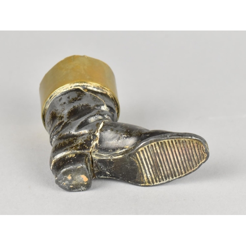 9 - An Interesting Spelter and Brass Novelty Match Holder/Striker in the Form of a Boot, 6cms HIgh