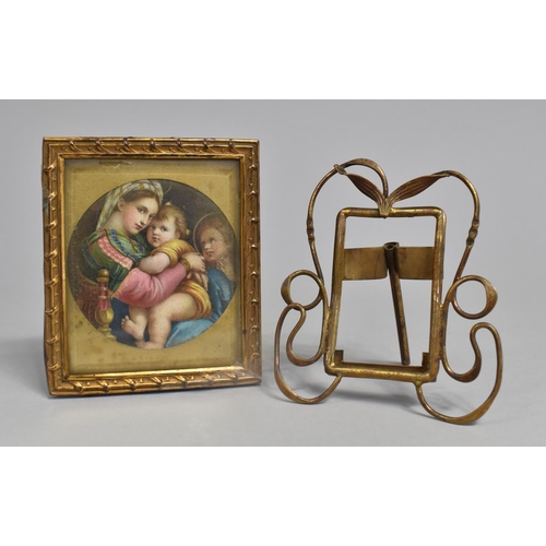 35 - A Small Art Nouveau Brass Easel Back Photo Frame, 10x8.5cms, together with a Gilt Framed Religious M... 