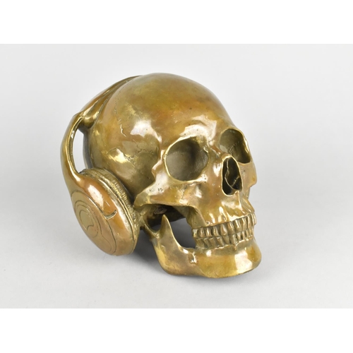 235 - A Modern Bronze Sculpture of Skull Wearing Headphones, 15cms High