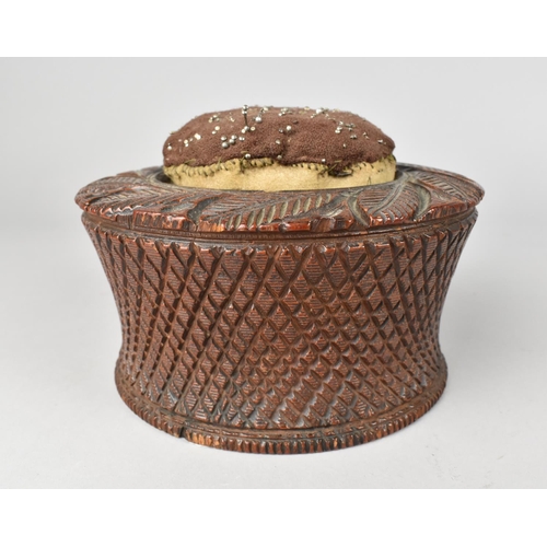 10 - A Late 19th Century Carved Wooden Circular Pin Cushion, 15cms Diameter and 10cms High