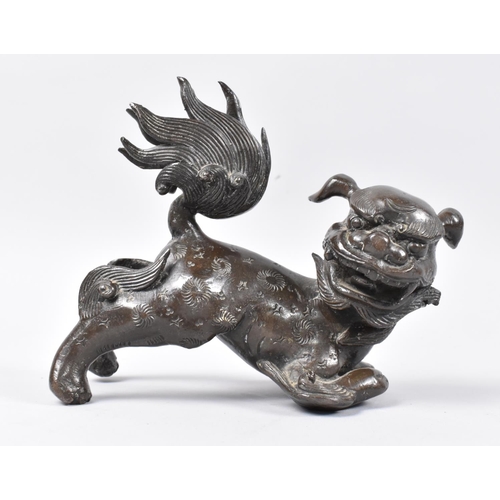 11 - A Heavy Patinated Bronze Chinese Temple Dog, 16cms Long