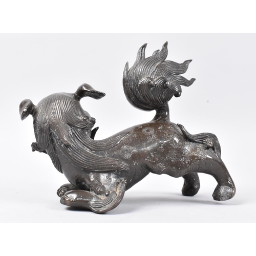 11 - A Heavy Patinated Bronze Chinese Temple Dog, 16cms Long