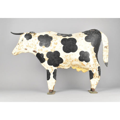 113 - A Large Modern Painted Tin Study of a Friesian Cow, 64cms Long