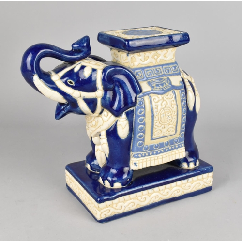 129 - A Small Blue and White Glazed Stoneware Souvenir Indian Stool in the Form of an Elephant, 23cms Wide... 