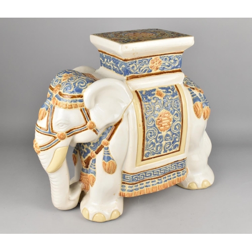 135 - A Large Indian Glazed Souvenir Stool in the Form of an Elephant, 47cms Wide and 43cms High