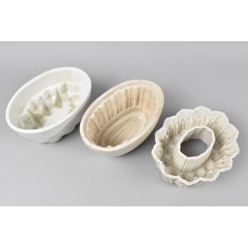 142 - Three Late Victorian White Glazed Jelly Moulds