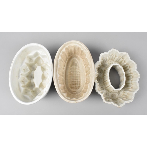 142 - Three Late Victorian White Glazed Jelly Moulds