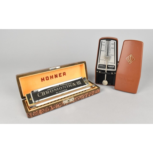 165 - A Taktell Junior Metronome by Wittner and a Hohner Cased Chromonika III