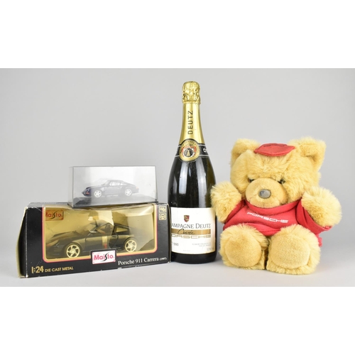 173 - A Single Bottle Porsche Champagne Deutz Brut 1990, together with Two Diecast Porsche Models and a Po... 