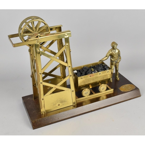 2 - A Vintage Brass Model of Welsh Miner, Coal Cart and Pit Head on Wooden Plinth, 33cms Wide