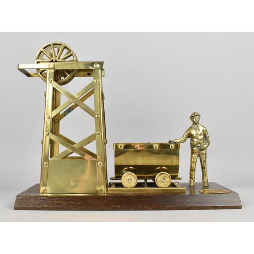 2 - A Vintage Brass Model of Welsh Miner, Coal Cart and Pit Head on Wooden Plinth, 33cms Wide