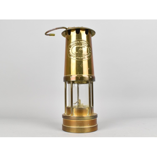 25 - A Brass Souvenir Miners Safety Lamp, as was Made by Thomas and Williams Limited Aberdare, 27cms High