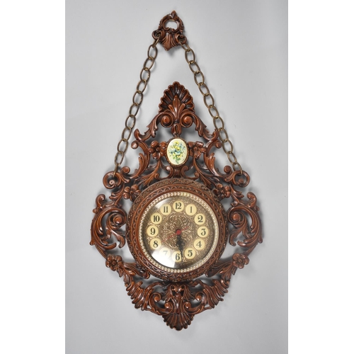 280 - A Late 20th Century Plastic Carved Wood Effect Wall Clock