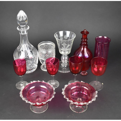 327 - A Collection of Various Plain and Cranberry Glass to Comprise Decanters, Vases, Drinking Glasses, Pe... 