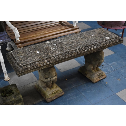 381 - A Reconstituted Stone Garden Bench with Squirrel Supports, 111cm wide