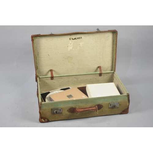 408 - A Vintage Canvas and Leather Covered Suitcase Containing Various Table Mats Etc