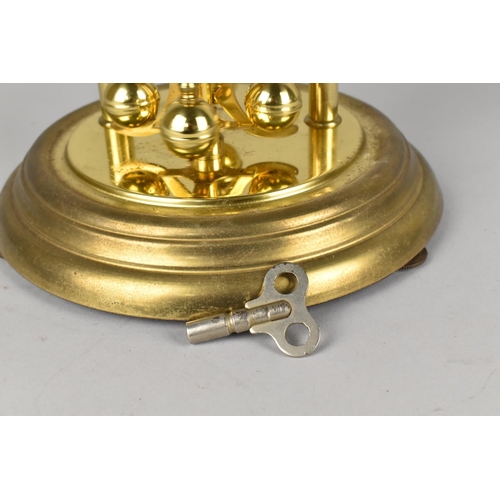 41 - A Mid 20th Century German Koma Brass Pillar Clock under Glass Dome, with Key, 30cms High