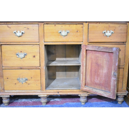 426 - A Mid 20th Century Pine Dresser, Base with Centre Drawer over Cupboard Flanked by Two Banks of Three... 