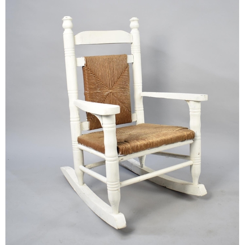 430 - A White Painted Rush Seated Childs Rocking Chair