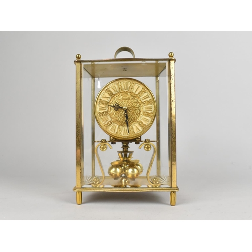 56 - A Mid 20th Century Brass Cased Four Glass Pillar Clock by Kundo, 21.5cms High