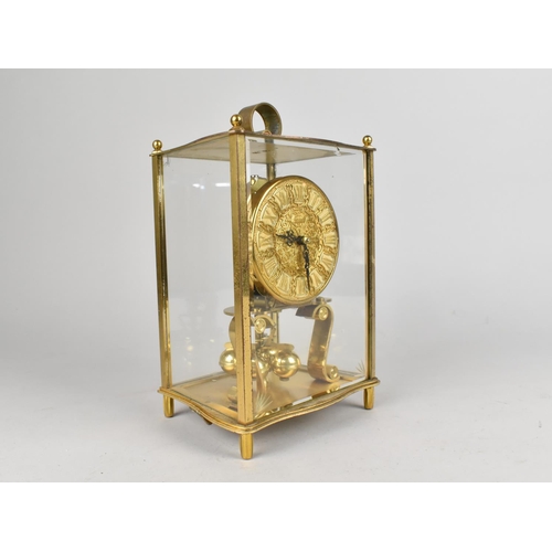 56 - A Mid 20th Century Brass Cased Four Glass Pillar Clock by Kundo, 21.5cms High