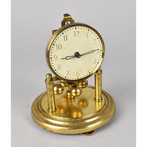 60 - A Small Brass Pillar Clock under Glass Dome, 17cms High