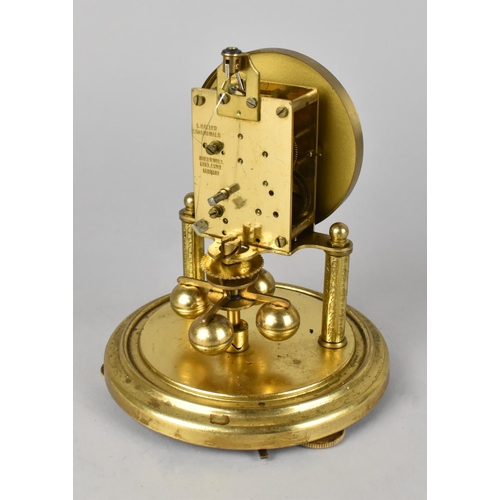 60 - A Small Brass Pillar Clock under Glass Dome, 17cms High