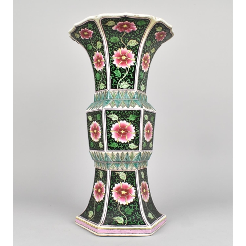 61 - A Chinese Qing Dynasty Famille Noire Gu Vase of Hexagonal Form, 31.5cms High, Decorated with Flowers... 