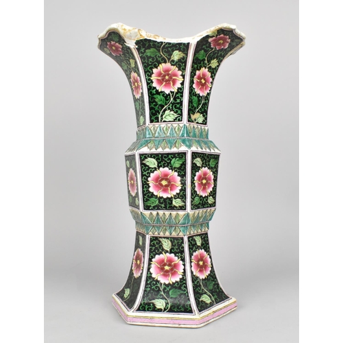 61 - A Chinese Qing Dynasty Famille Noire Gu Vase of Hexagonal Form, 31.5cms High, Decorated with Flowers... 