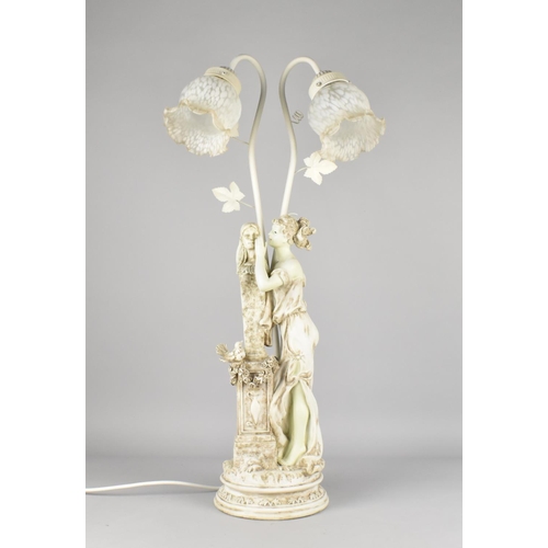 62 - A Modern Continental Figural Two Branch Table Lamp, 69cms High