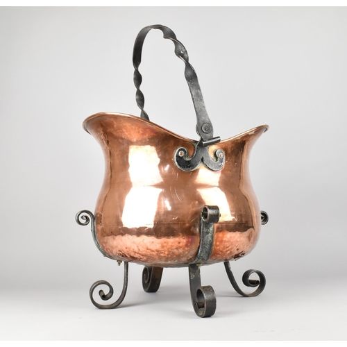 65 - An Ornamental Copper and Wrought Iron Planter in the Form of a Helmet Shaped Coal Scuttle with Four ... 