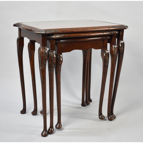 76 - A Modern Mahogany Nest of Three Tables with Tooled Leather Tops, 54cms Wide