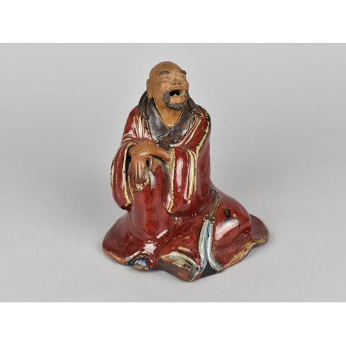 97 - An Enamelled Chinese Mudman, modelled seated 13cms High