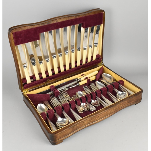 105 - An Oak Cased Canteen of Cutlery, 43cms Wide