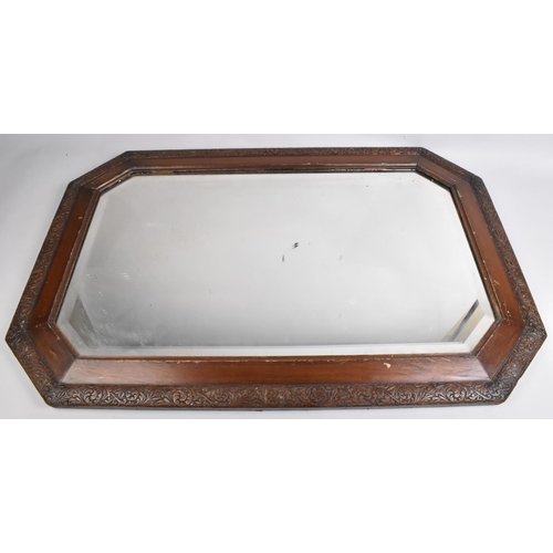 106 - A Rectangular Framed Mirror with Carved Trim and Bevelled Glass, 81cms Wide