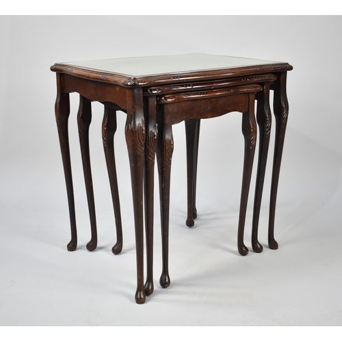 109 - A Nest of Three Tables with Glass and Tooled Leather Tops, 52cms Wide