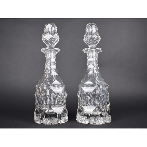 112 - A Pair of Late Victorian Cut Glass Decanters, 53cms High, Condition Issues