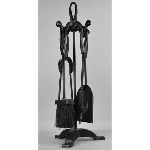 118 - A Wrought Metal Fire Companion, 54cms High