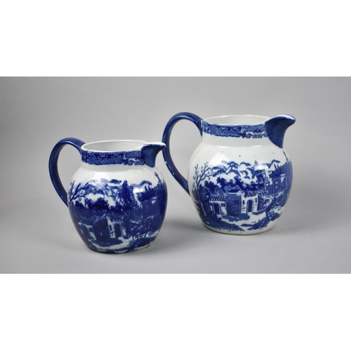 138 - Two Graduated Blue and White Transfer Printed Jugs